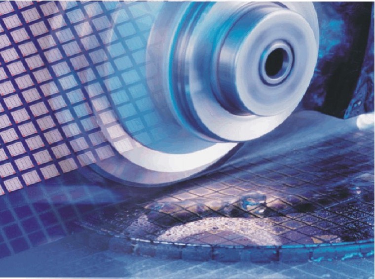 A dicing spindle cutting through a wafer